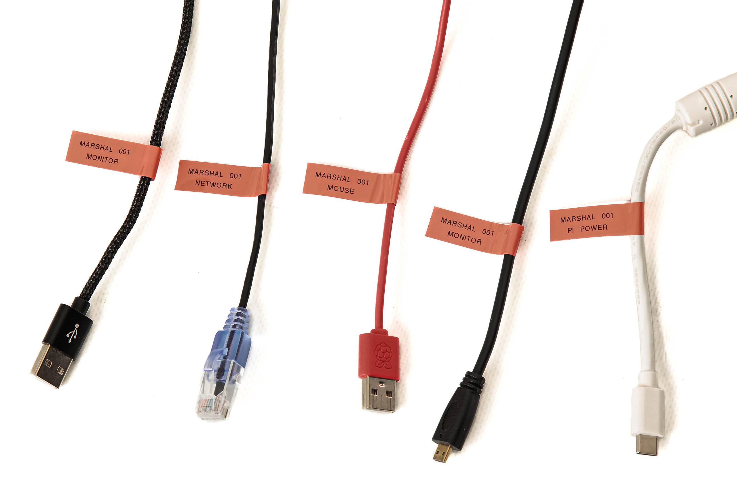 Wires from the OTIS kit labeled with the station, device, and function
